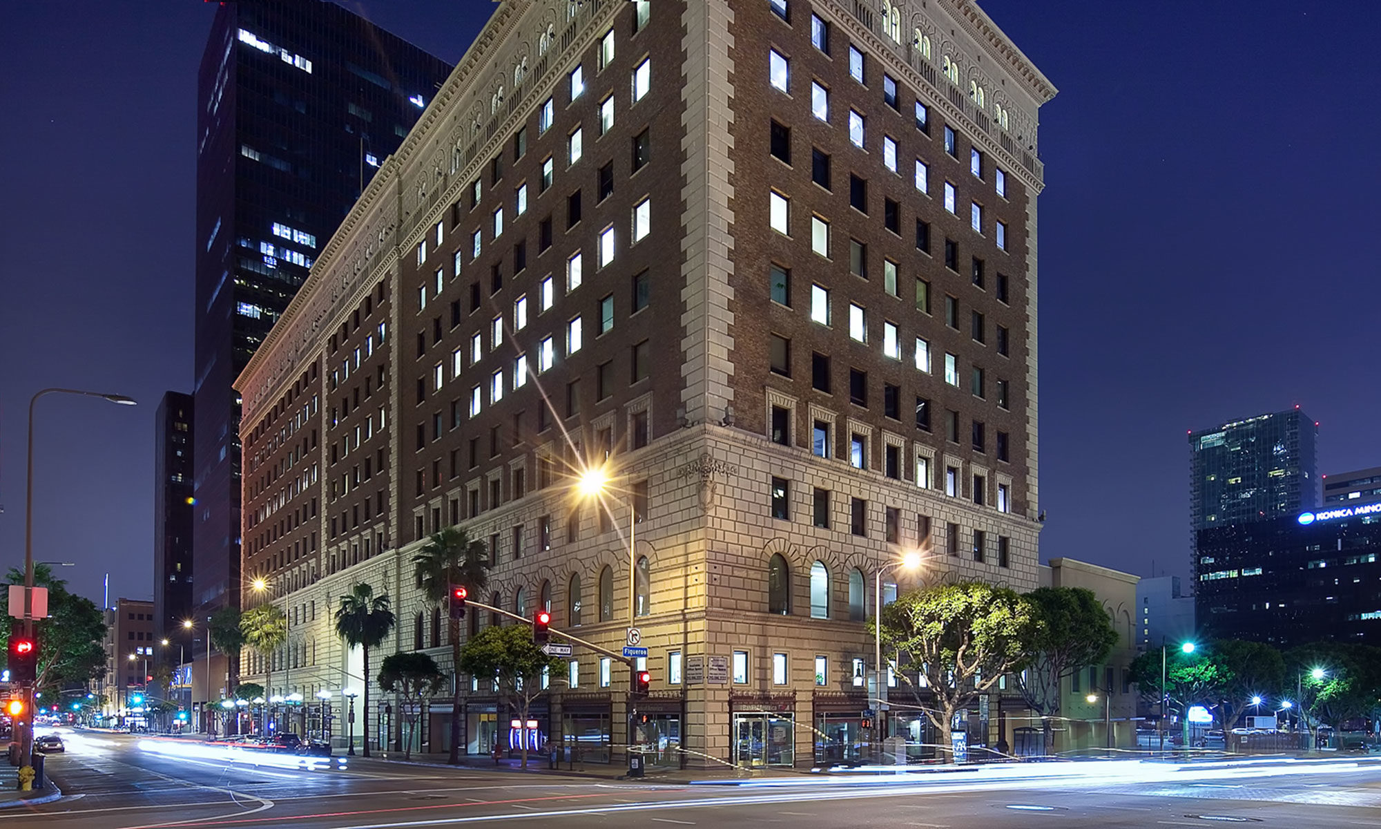 Photo of exterior of 818 Plaza building at night